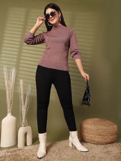 Women wearing light brown solid highneck full sleeve woolen top with black pants.