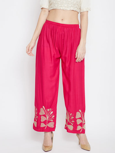 Magenta embroidered straight palazzo pants with floral design.