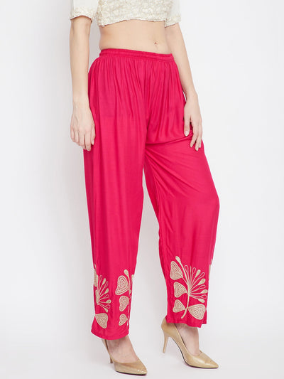 Magenta embroidered straight palazzo pants with intricate designs.