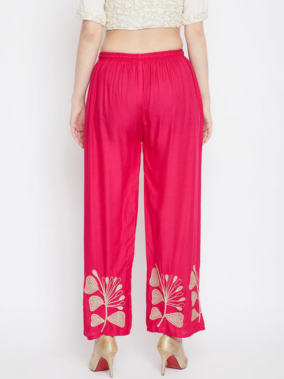 Magenta embroidered straight palazzo with floral designs.