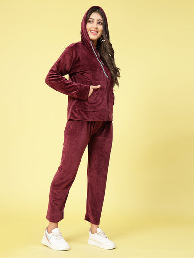 Women solid hooded velvet co-ord set with zip closure and elastic waistband.