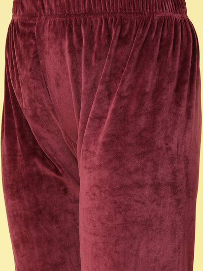 Women solid hooded velvet co-ord set with elastic waistband and zip closure.
