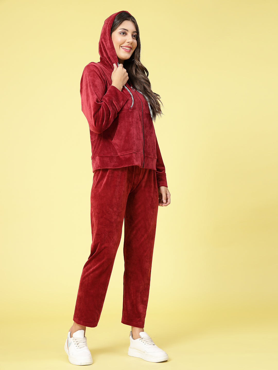 Women solid hooded velvet co-ord set with long sleeves and elastic waistband.