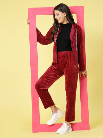 Women solid hooded velvet co-ord set with long sleeves and zip closure.