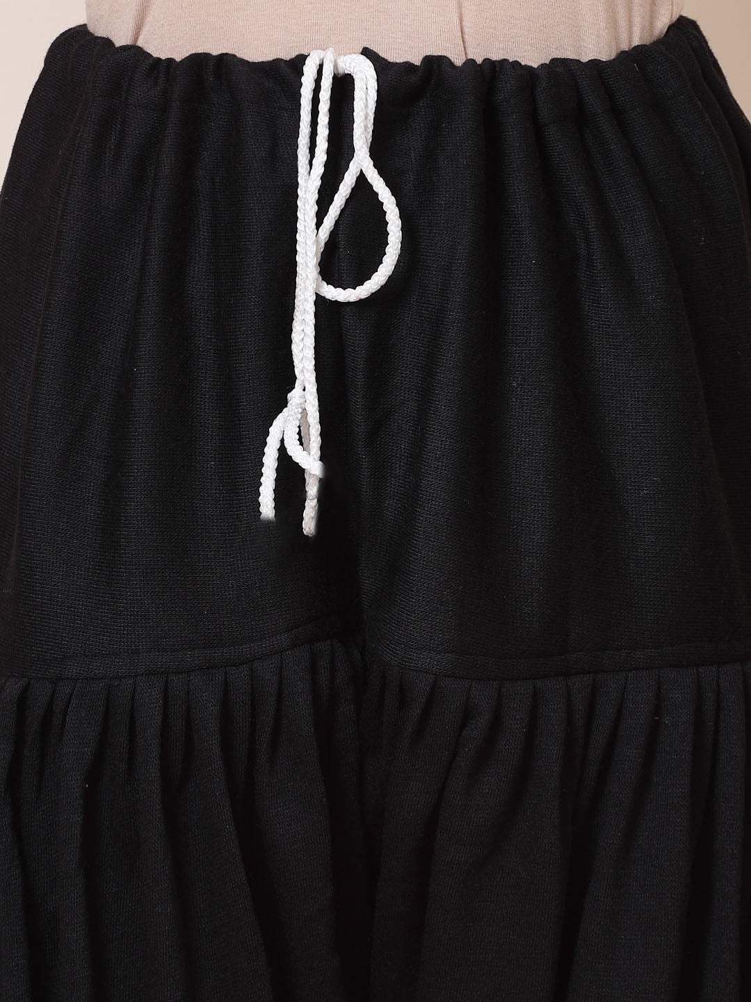 Black & Red Solid Woolen Salwar Pack with drawstring closure.