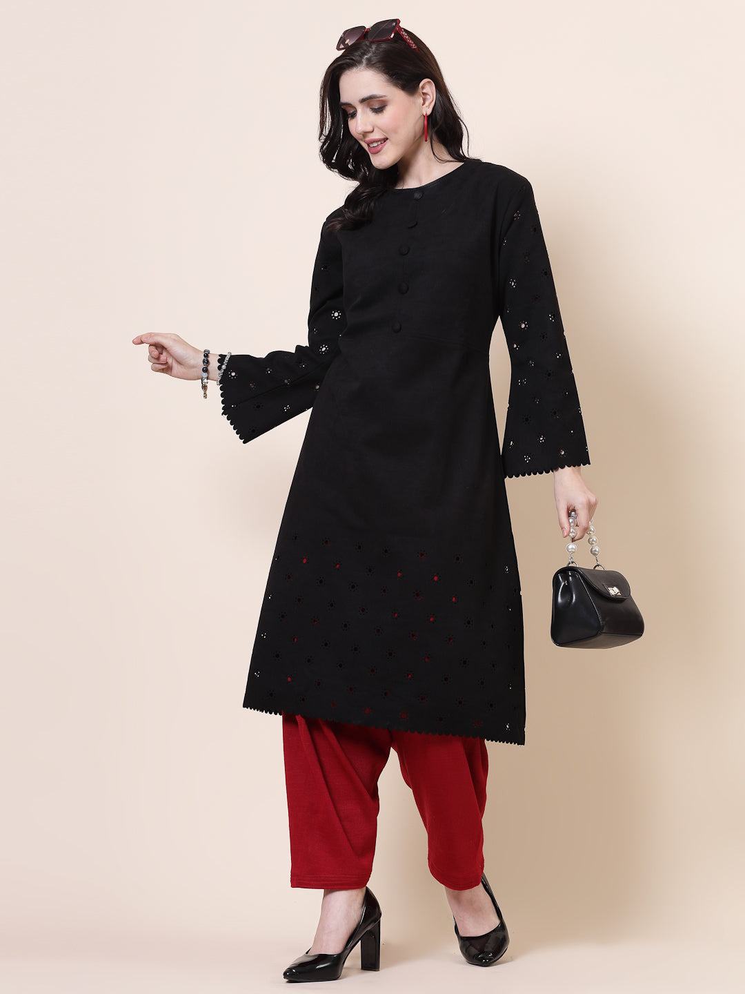 Maroon and red solid woolen salwar pack with loose-fit semi Patiala style and drawstring closure.