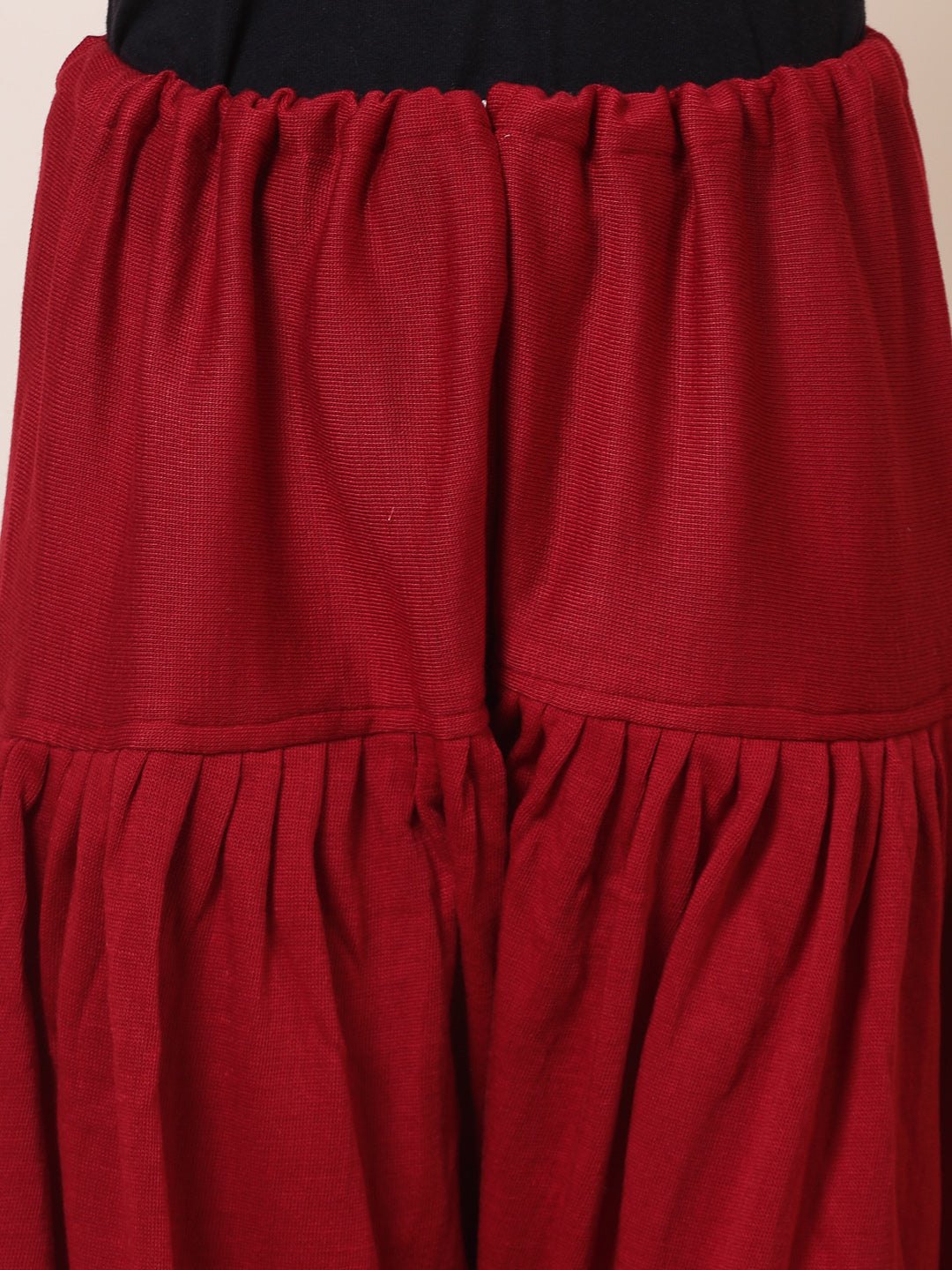 Maroon & red solid woolen salwar pack, loose-fit semi Patiala with drawstring closure.