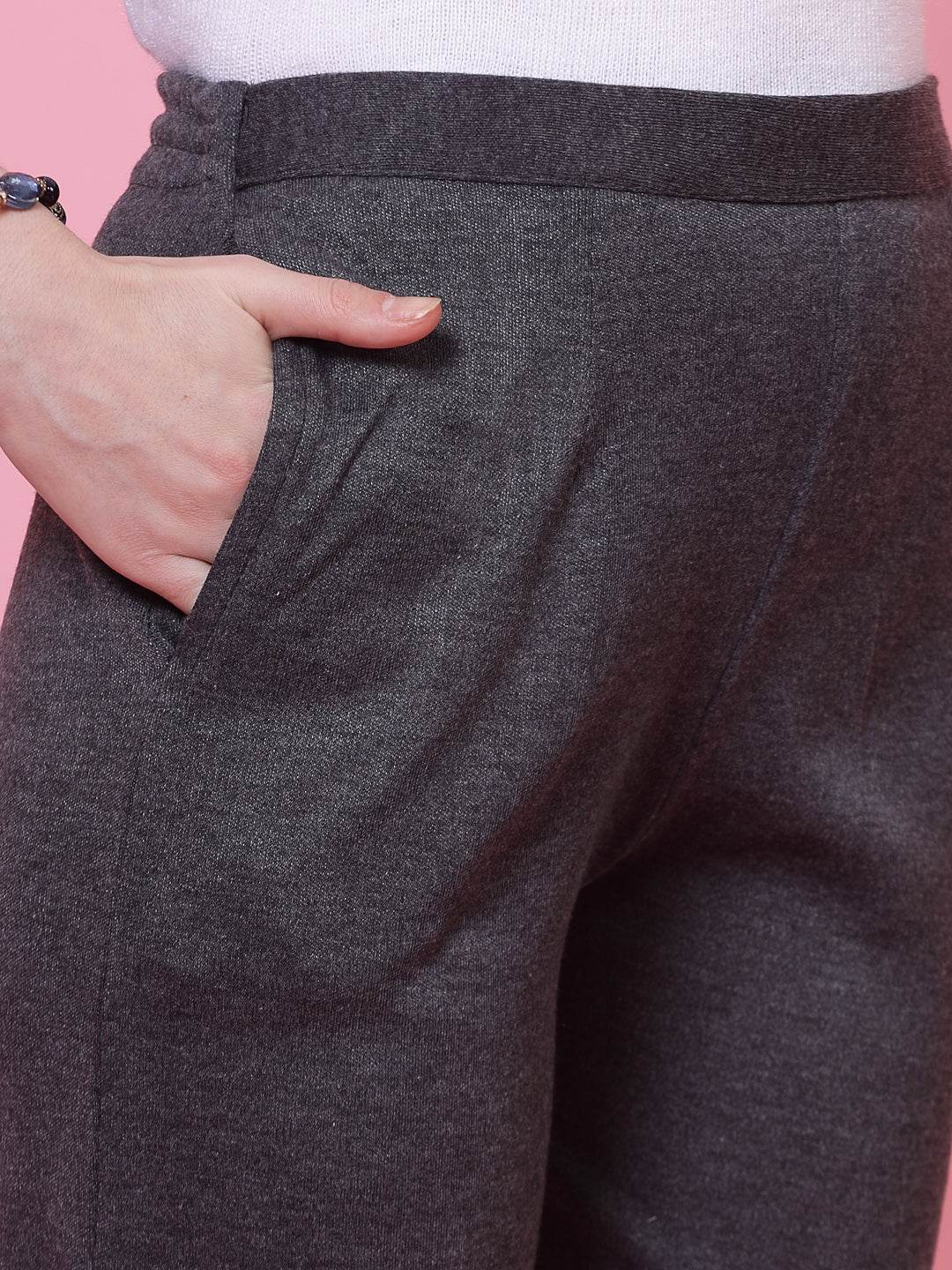 Dark grey woolen trouser with elasticated waistband and side pocket.