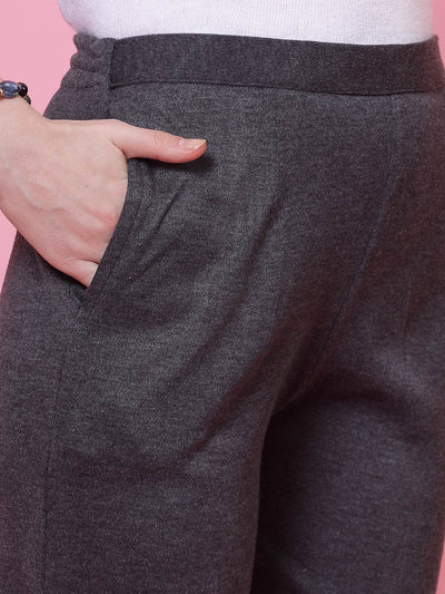 Dark grey woolen trouser with elasticated waistband and side pocket.