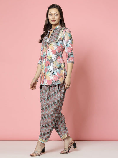 Floral printed embellished kurti with dhoti pants in peach and black, featuring three-quarter sleeves and mandarine collar.
