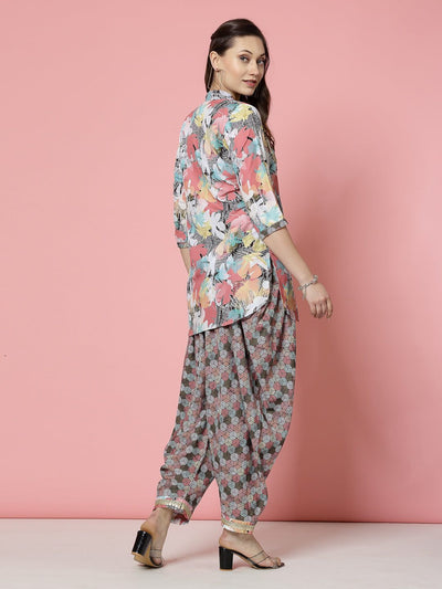 Floral printed embellished kurti with dhoti pants, peach and black, three-quarter sleeves.