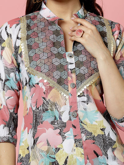 Floral printed embellished kurti with geometric design and three-quarter sleeves.