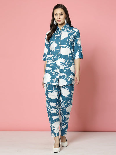 Abstract printed shirt with three-quarter sleeves and matching trousers in blue and white pattern.