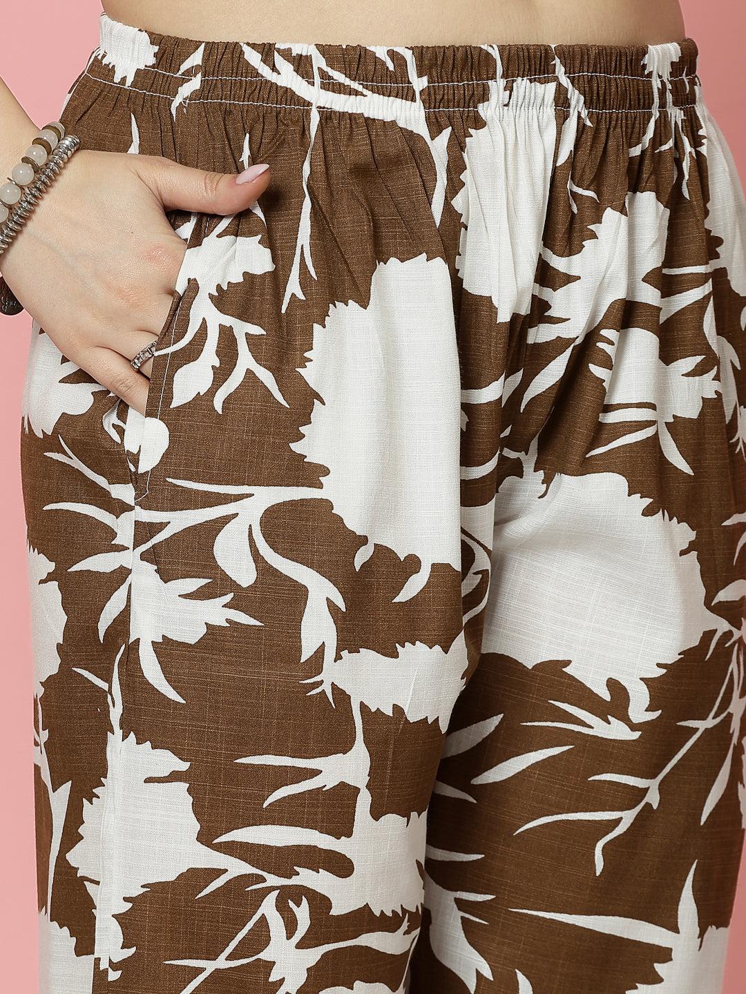Abstract printed shirt and trouser co-ords with brown and white pattern, featuring elasticated waistband.