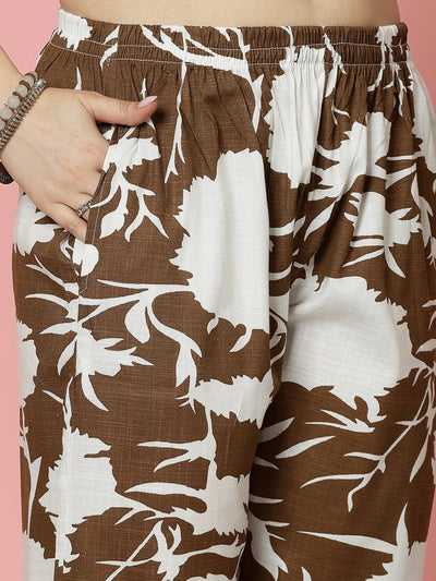 Abstract printed shirt and trouser co-ords with brown and white pattern, featuring elasticated waistband.