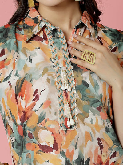 Abstract printed shirt collar kurti in orange and multicolored design.