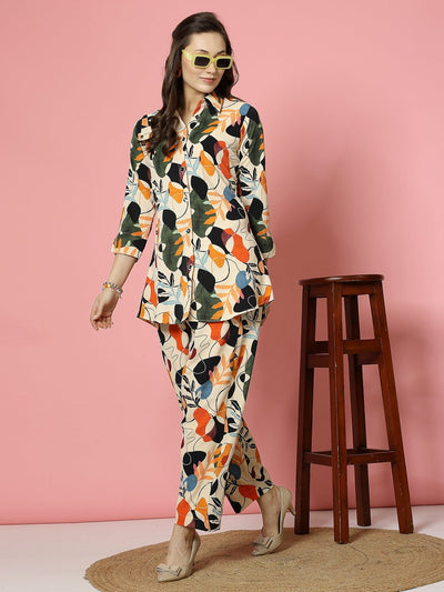 Floral digital printed co-ords with orange and black shirt and trousers.