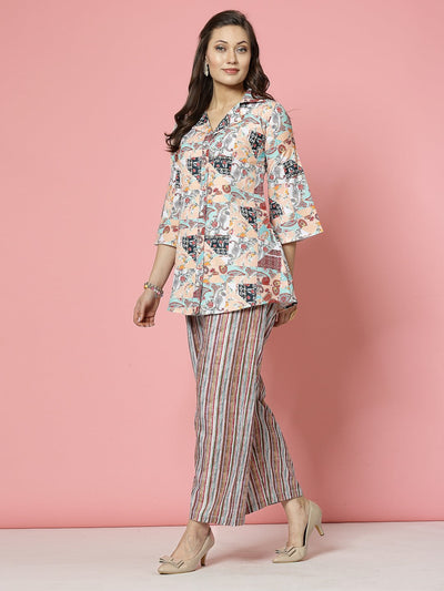 Peach paisley printed tunic top with trousers co-ords, featuring three-quarter sleeves and button details.