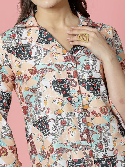 Peach paisley printed tunic top with three-quarter sleeves and shirt collar.