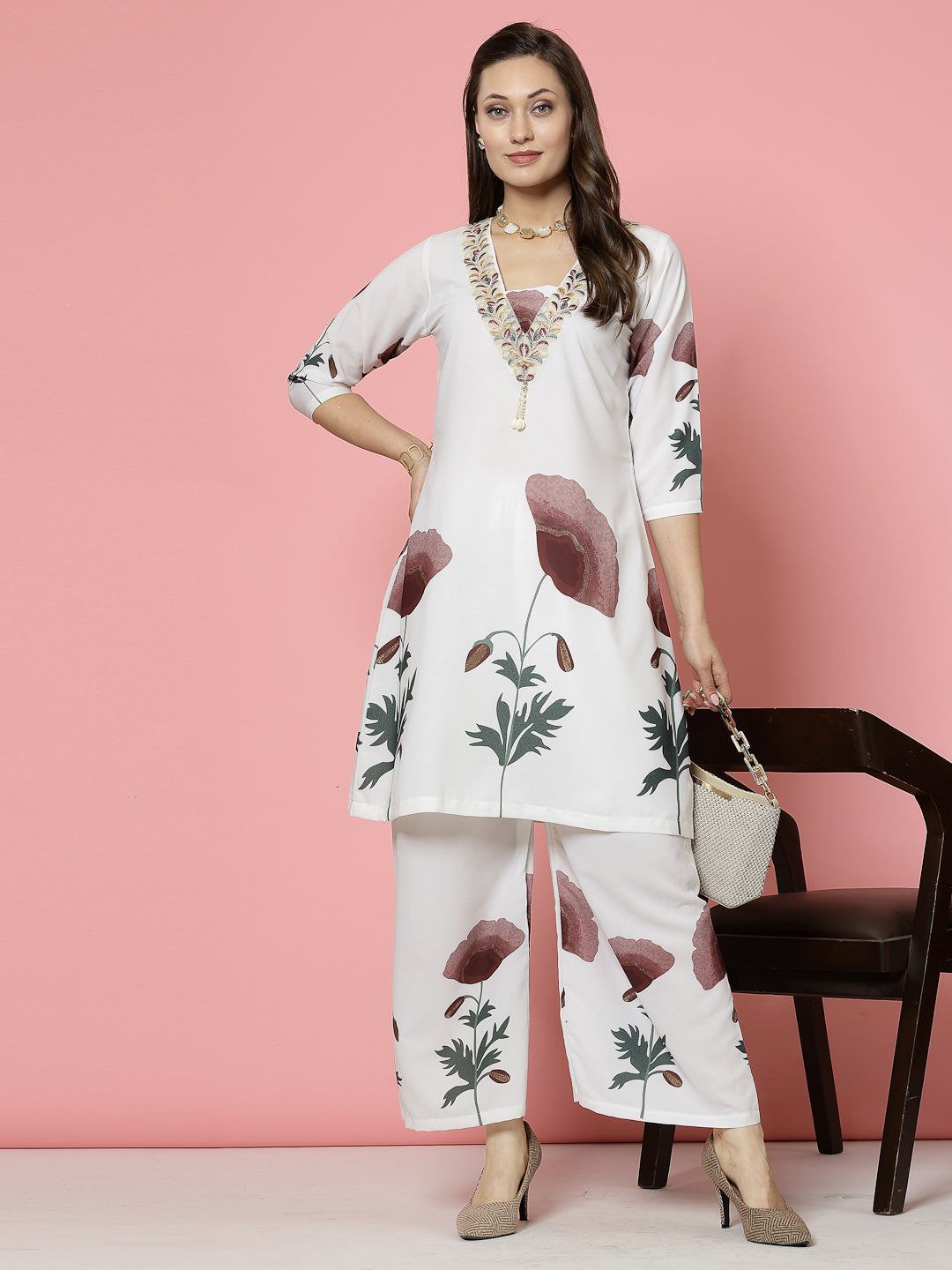Floral printed tunic top with palazzo co-ords, featuring embellished V-neck and three-quarter sleeves.