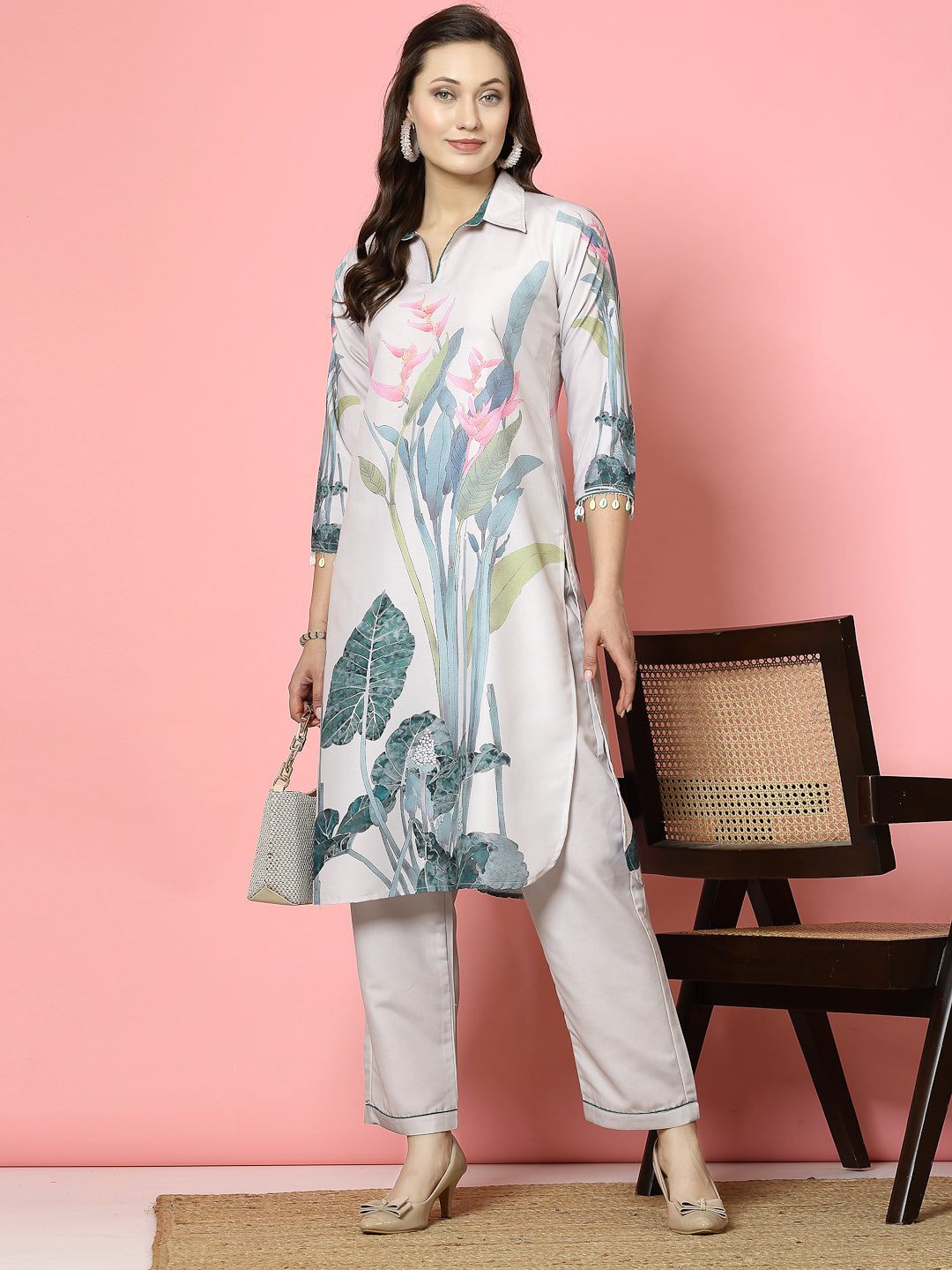 Floral printed shirt collar kurta with beige trousers set.