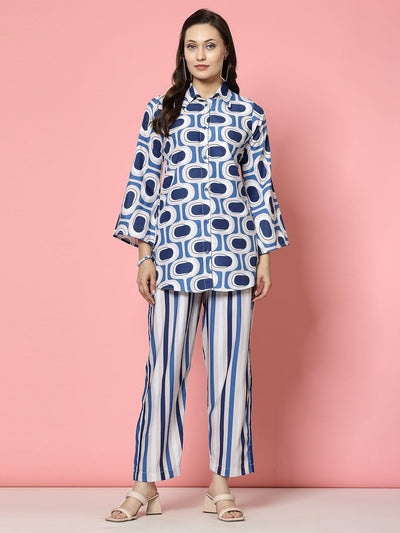 Geometric printed shirt with bell sleeves and matching striped trousers set.