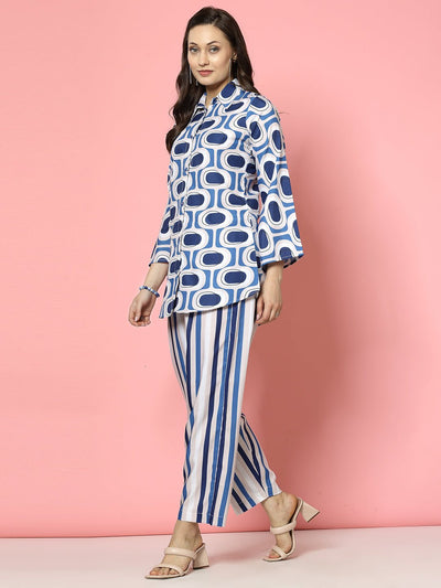 Geometric printed shirt with bell sleeves and striped trousers co-ords.
