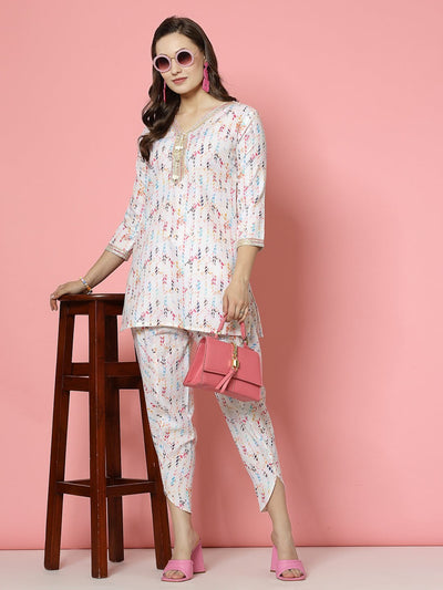 Geometric digital printed tunic top and dhoti pants co-ords, off-white with multicolor print, V-neck and three-quarter sleeves.