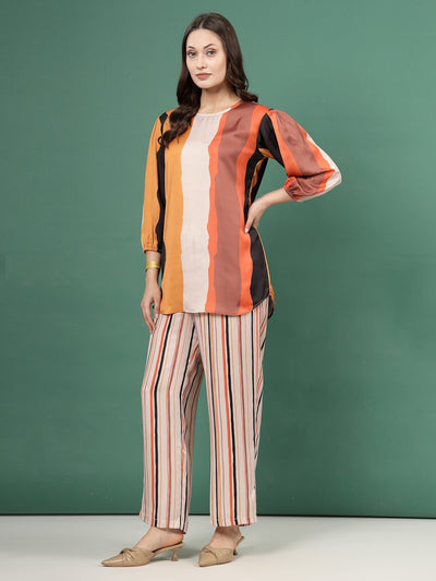 Geometric printed orange black tunic and striped trousers co-ords set with three-quarter sleeves.