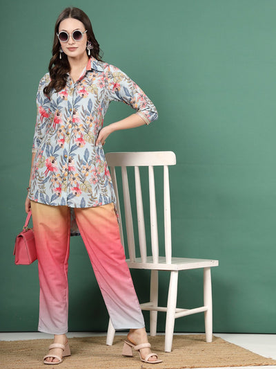 Light blue ombre design printed shirt with floral pattern and pink trousers co-ords.