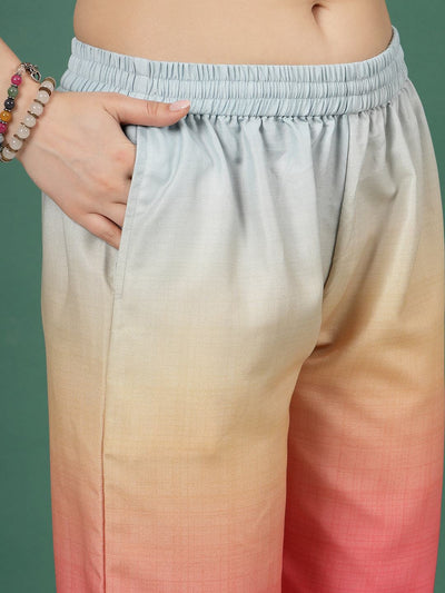 Light blue ombre design printed trousers with elastic waistband and pink gradient.