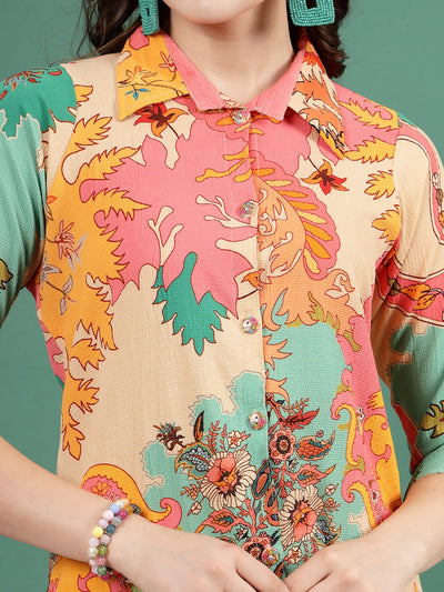 Abstract printed shirt with colorful design, three-quarter sleeves, and collar.