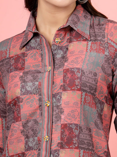 Peach floral printed shirt with three-quarter sleeves and button closure.