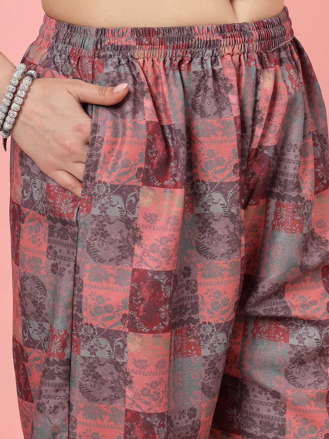 Peach floral printed shirt and trousers co-ords with grey digital pattern.