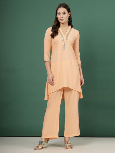 Peach embellished V-neck kurta with three-quarter sleeves and palazzo set.