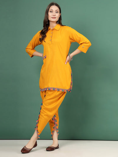 Mustard embellished shirt collar Kurti with dhoti pants, three-quarter sleeves, and button closure.