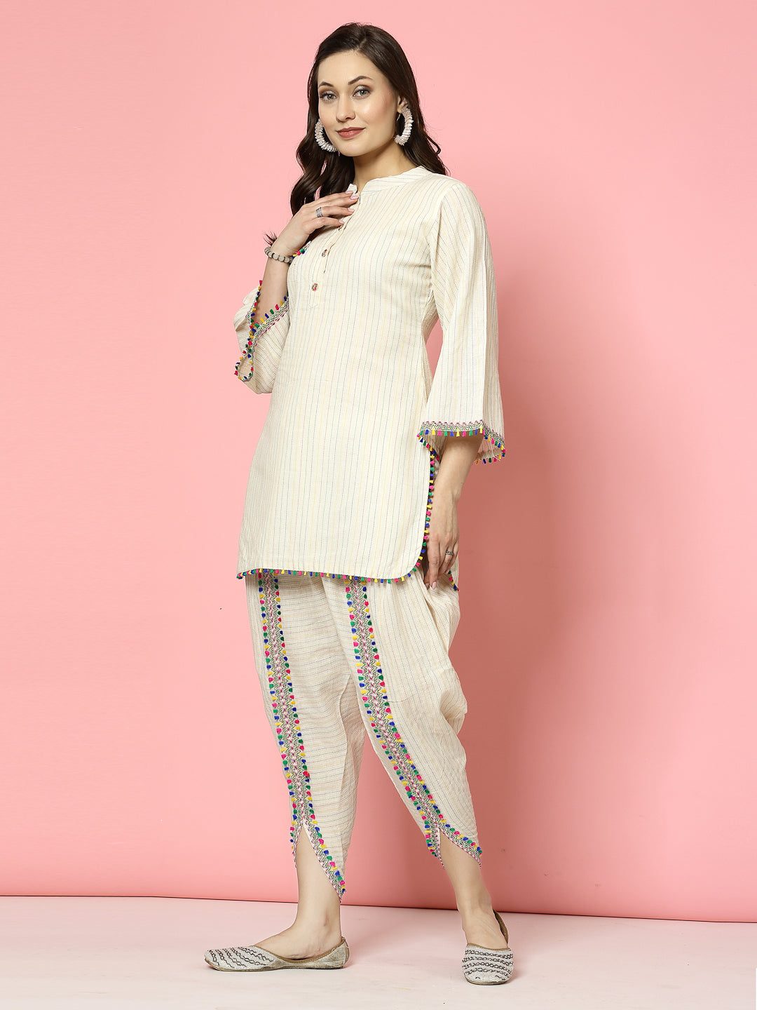 Kantha work mandarin collar kurti with dhoti pants featuring cream and multicolored embellishments.