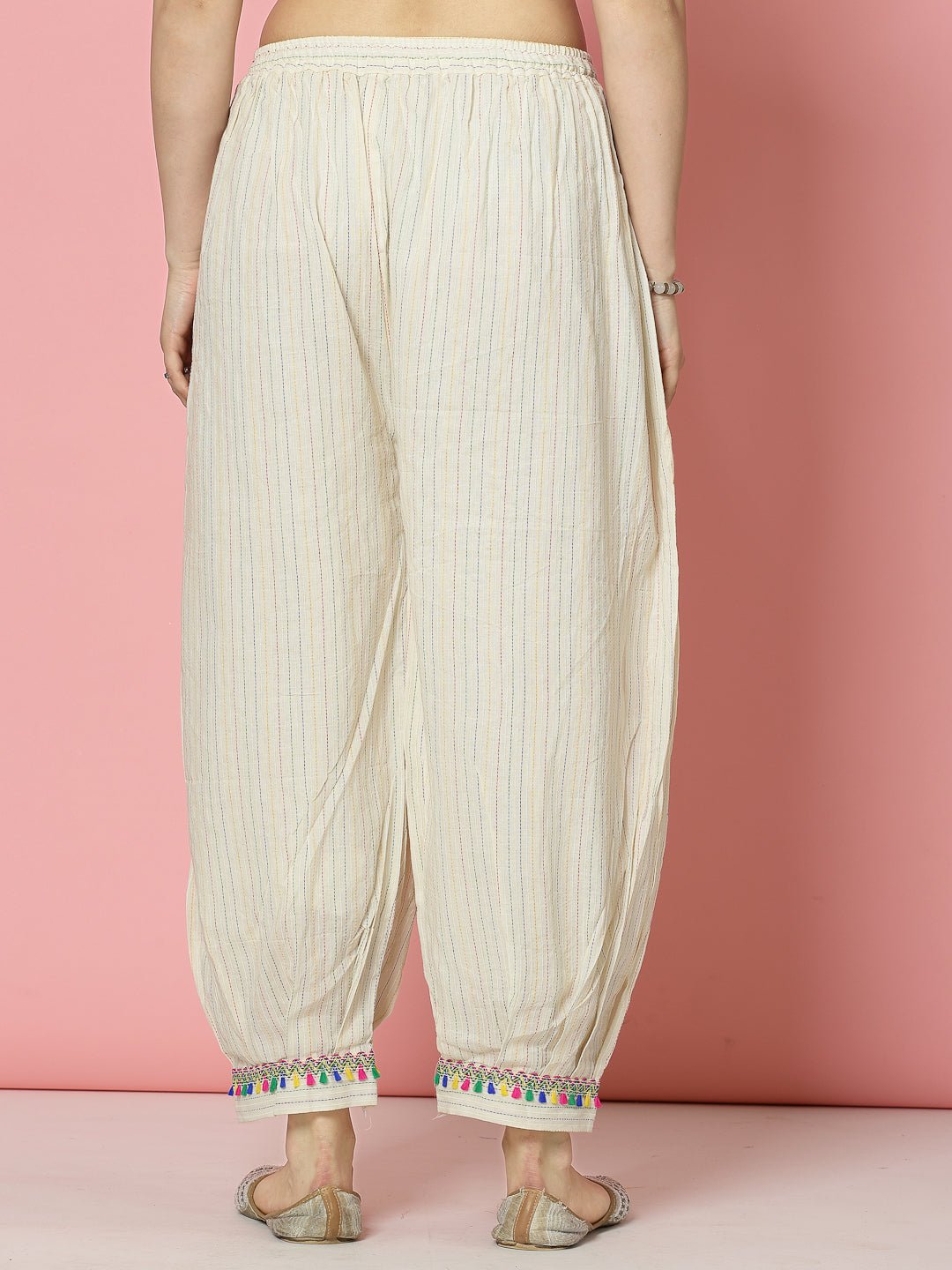 Kantha work loose fit Afghani salwar in white cotton showcasing a graceful and comfortable silhouette.