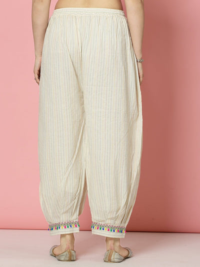 Kantha work loose fit Afghani salwar in white cotton showcasing a graceful and comfortable silhouette.