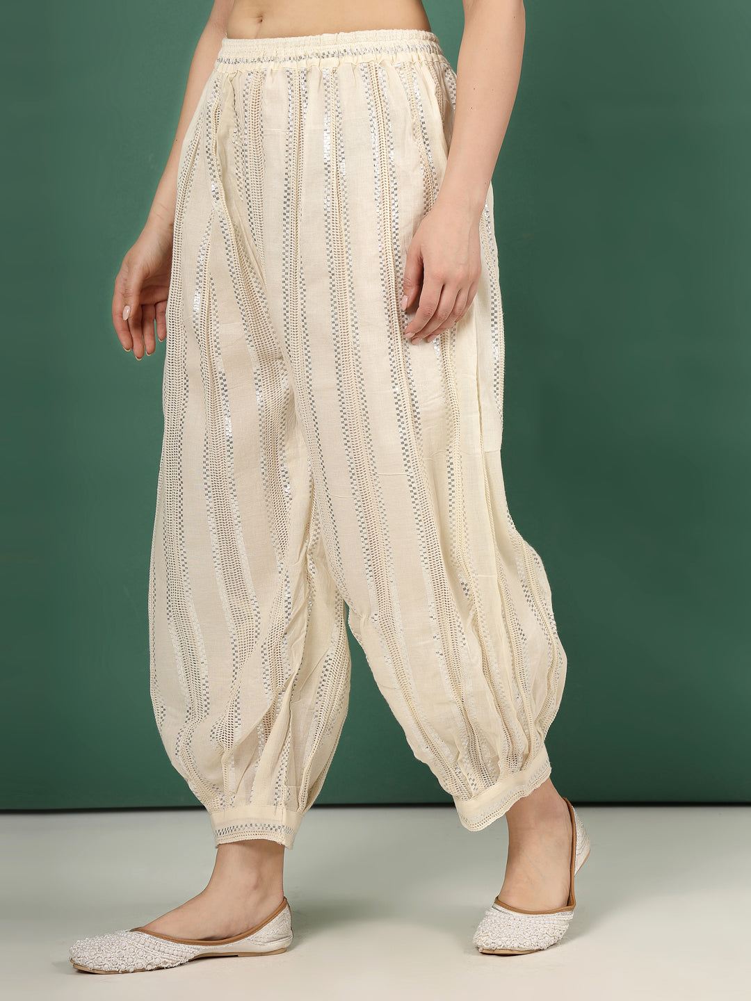 Self design loose fit cotton Afghani salwar with Lurex details.
