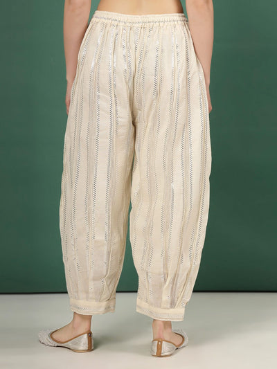 Self design loose fit cotton Afghani salwar with Lurex threads.