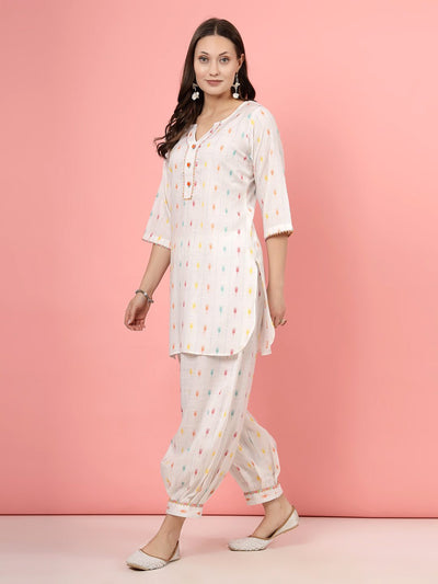 Ikat printed V-neck kurti with white multicolored Afghani pants, three-quarter sleeves, and elasticated waistband.