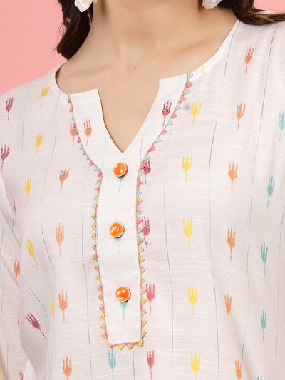 Ikat printed V-neck tunic with colorful threadwork and lace detailing.