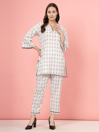 Ikat printed shirt collar kurti with navy palazzo set, three-quarter sleeves, high-low hemline.