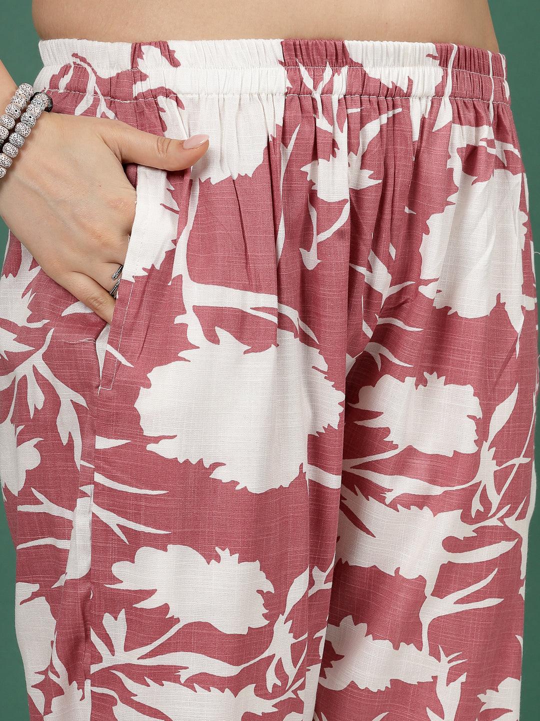 Abstract printed trousers with elastic waistband and floral pattern.