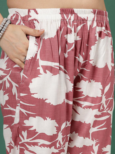 Abstract printed trousers with elastic waistband and floral pattern.
