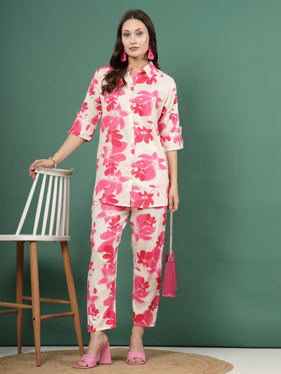 Floral printed shirt and trousers co-ords with pink flowers, button closure, and elasticated waistband.