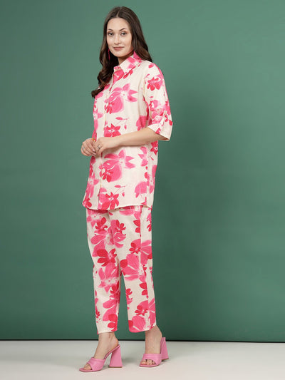 Pink floral printed shirt and trousers co-ords with button closure and elasticated waistband.