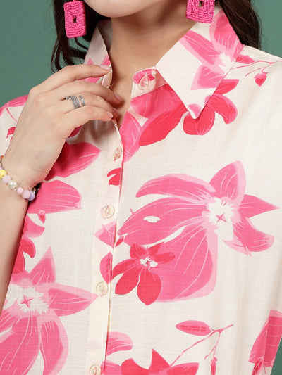 Floral printed shirt with pink flowers and button closure.