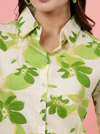 Floral printed shirt with green leaf pattern and button closure.